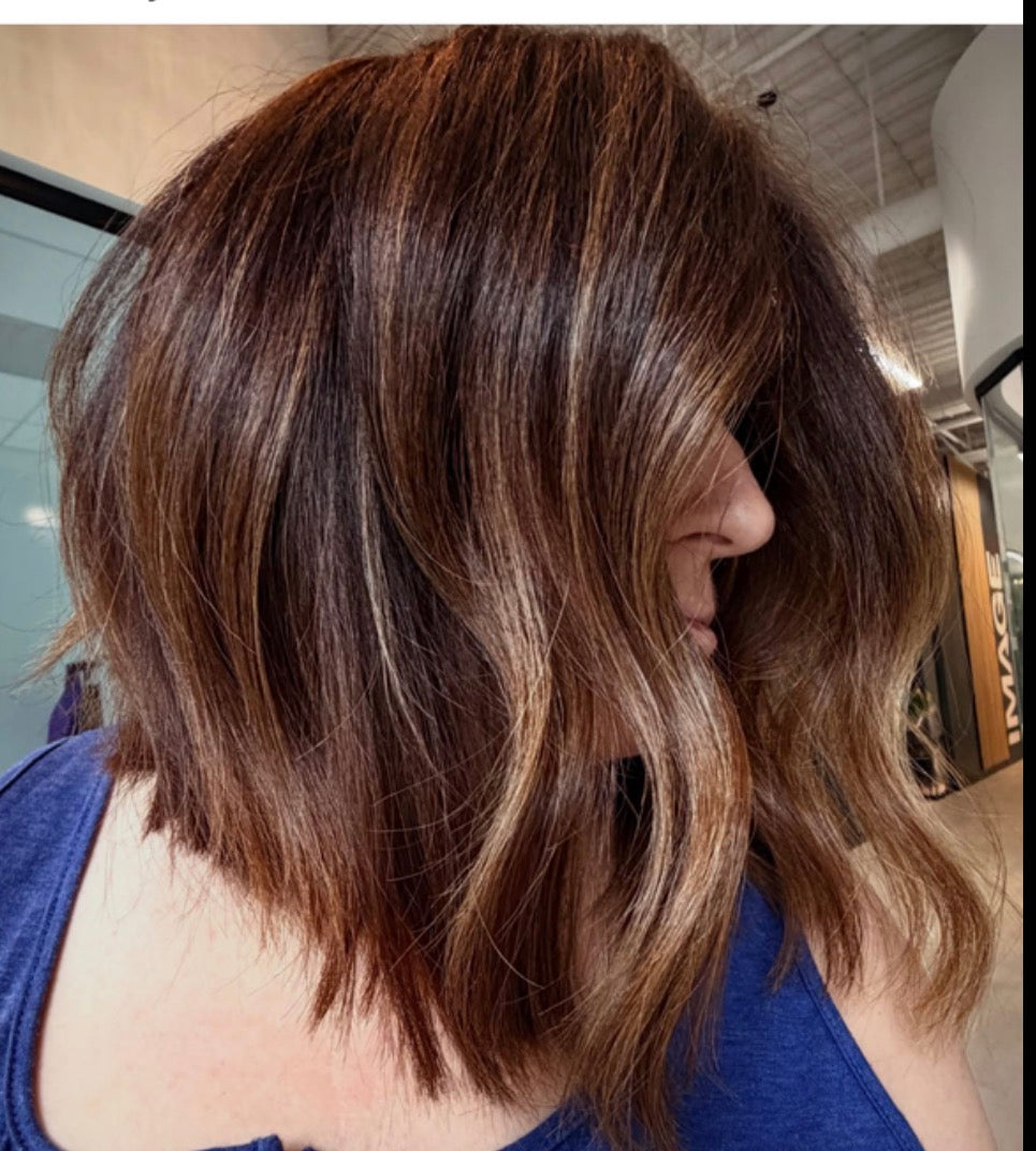 Woman using natural products for hair care routine