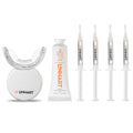The Professional Whitening Kit featuring a white LED light device, a white gel tube, and four clear syringes with orange LINHART branding.